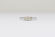 14 Karat Three Stone Diamond Engagement Ring with Round Center